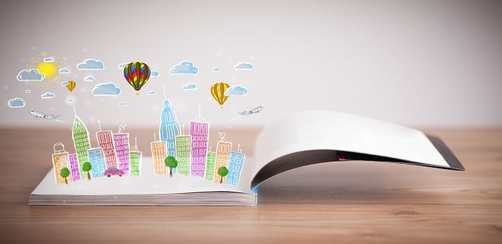 開いた本に描く都市の景観